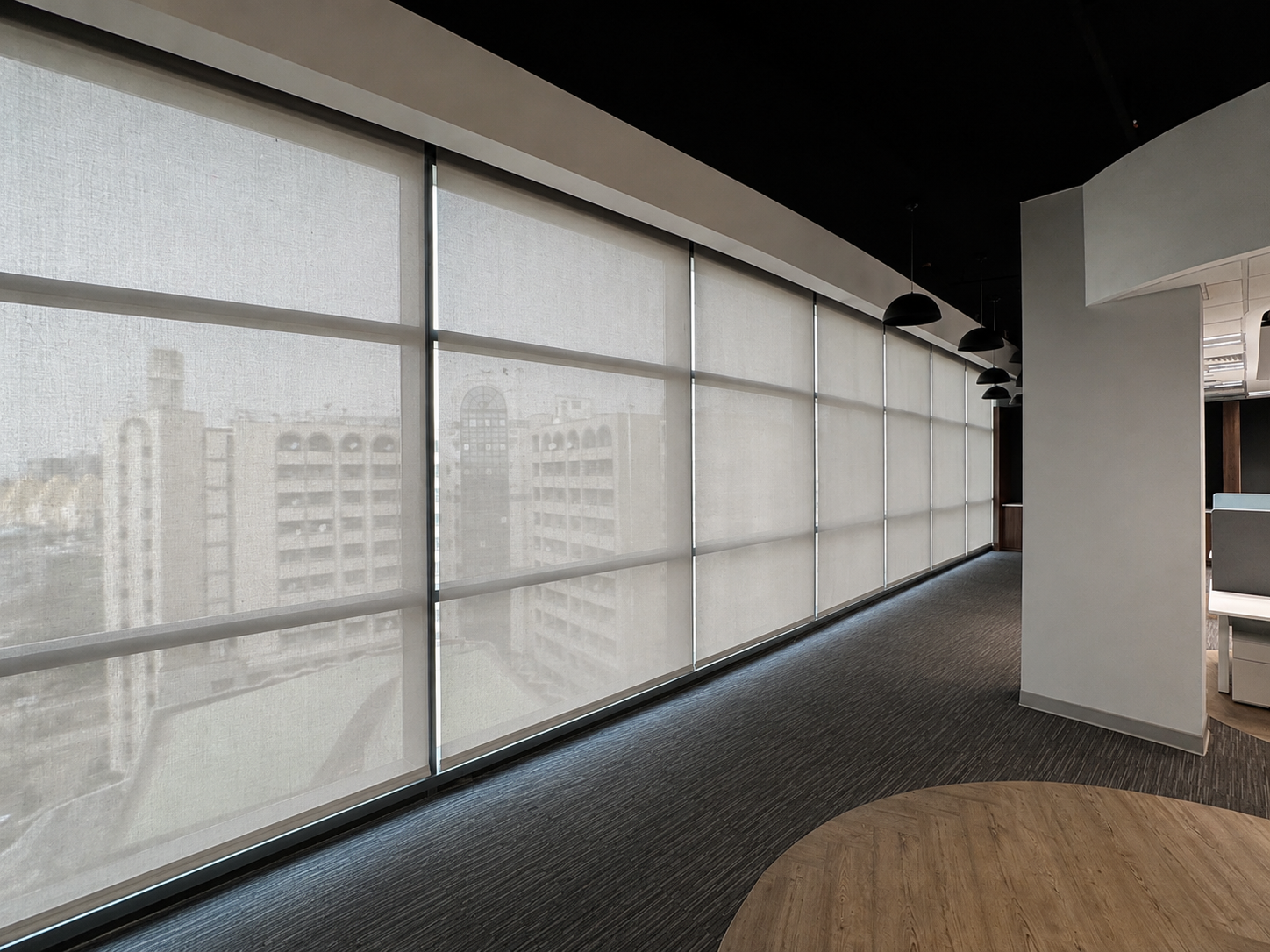 MShades roller shades fitted across a contemporary interior